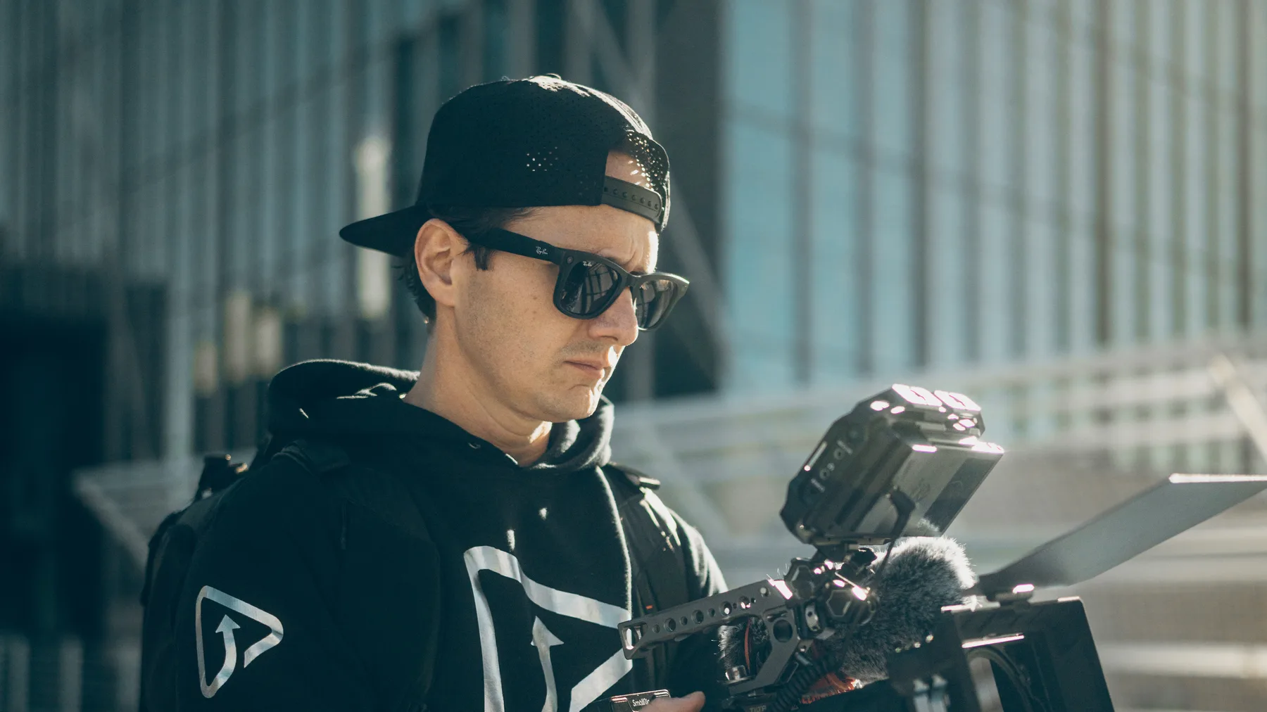 Zach Watkins filming with a professional cinema camera